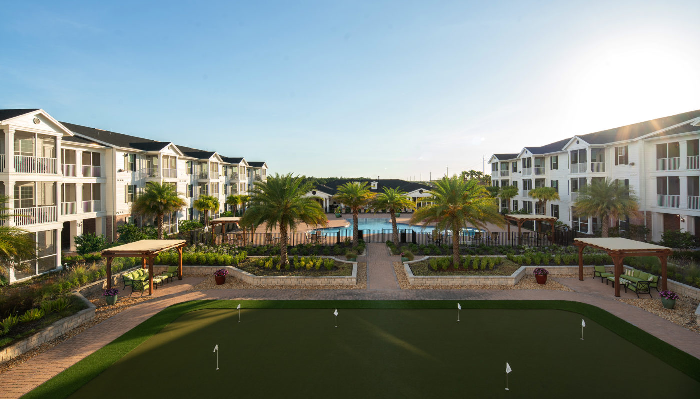 Aerial view of golf course and walkways near community swimming pool