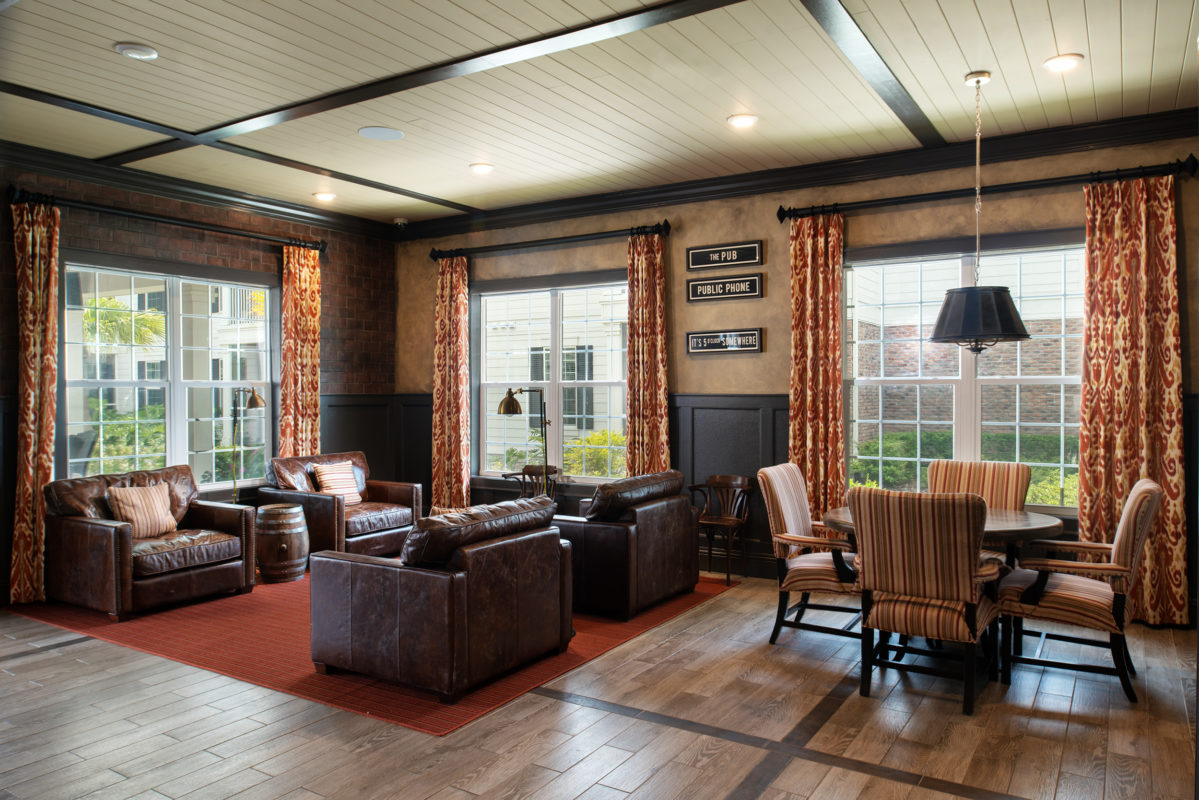 Community pub with leather armchair seating and card tables
