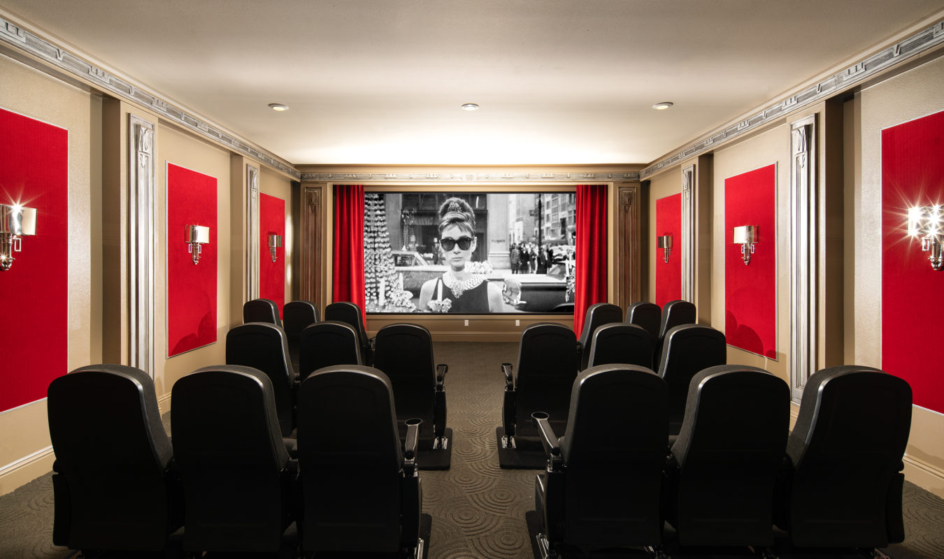 Community vintage-style and media room with large screens and theater seating