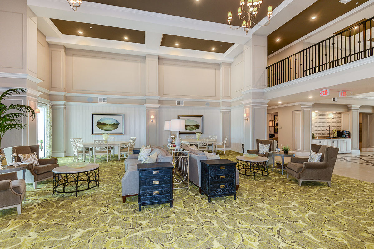 Grand leasing lobby interior with balcony and comfortable seating